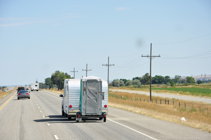 An interesting RV towing an outhouse