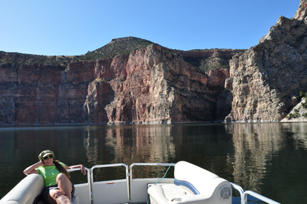 Karen Duquette enjoying Bighorn Lake and cliffs