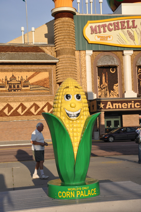 Lee and a tall stalk of corn