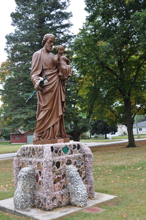 staute by the church