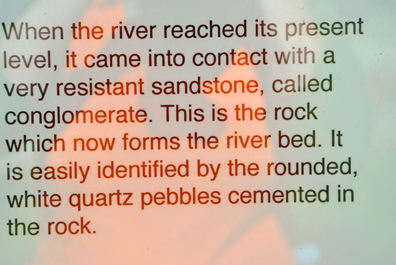 sign about the river and rocks