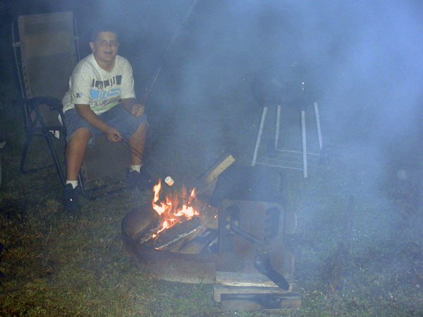 Alex Jones making s'mores