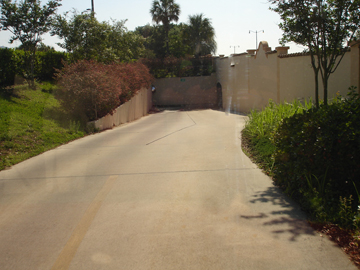 golf cart road leading to a tunnel