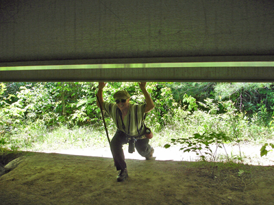 Karen Duquette ducking under the bridge