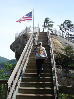 Karen Duquette climbing stairs to The Chimney