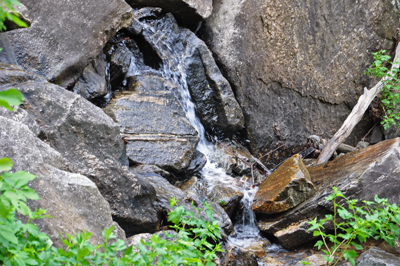 rocks at the bottom of the falls