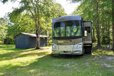 the RV of the two RV Gypsies in its new yard