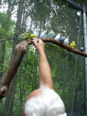 Lee Duquette feeding a bird