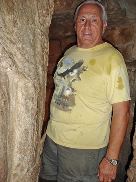 Lee Duquette getting  rained on in the cave