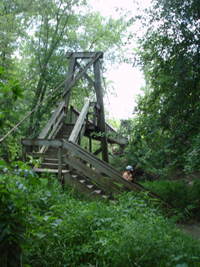 Karen Duquette on the stairs of the bridge