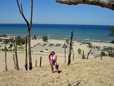 Karen Duquette almost to the top of the sand dune