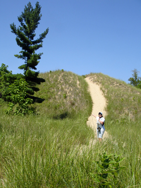 Karen starts to climb the first dune