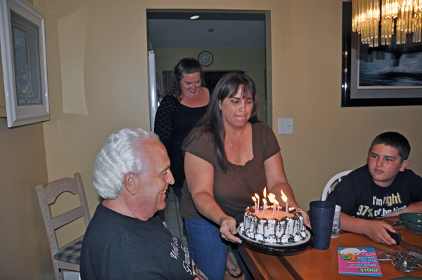 Renee brings her Dad a birthday cake