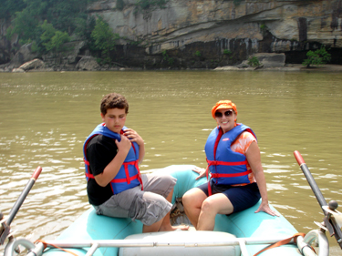 Karen Duquette and her grandson in the raft