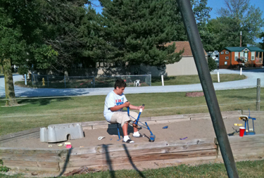 Alex in the playground at KOA