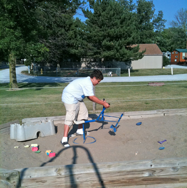 Alex in the playground at KOA