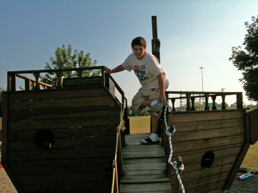 Alex in the playground at KOA