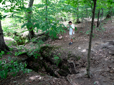 The grandson of the two RV Gypsies exploring the deep crevice