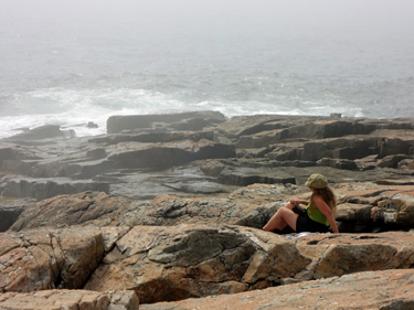 Karen Duquette watching the pounding surf.