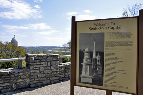 Kentucky's Capitol Building and a welcome sign