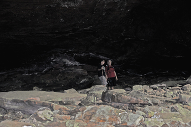 Lee Duquette and Alex under a big boulder by the Yahoo Arch.