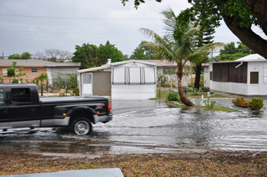 truck driving on the flooded road