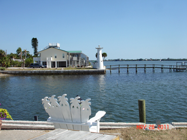 a lighthouse on the dock of a private yard