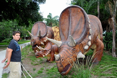 The two RV Gypsies' grandson and a Torosaurus Hylaeosaurus at Dinosaur World