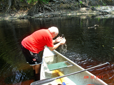 Lee had to hand shovel some of the water out of the canoe since the canoe did have a leak.