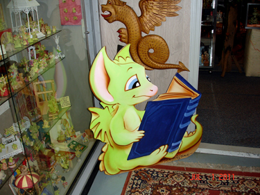 a dragon reading a book