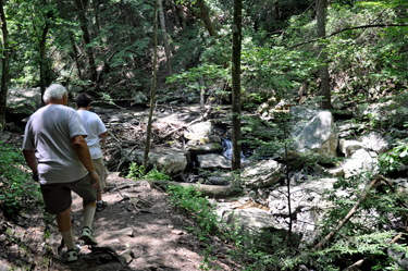 The two RV Gypsies and their grandson are approaching the first waterfall