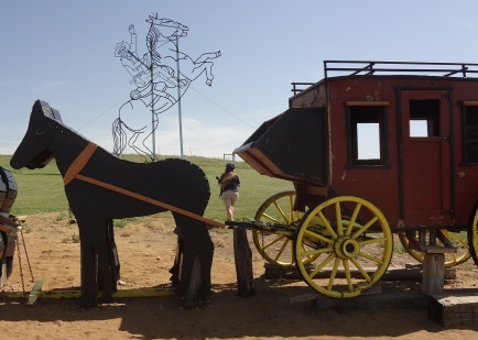 Karen Duquette by the stage coach on the Enchanted Highway