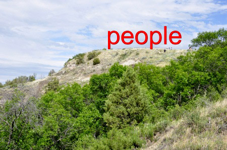 people at the top of the trail