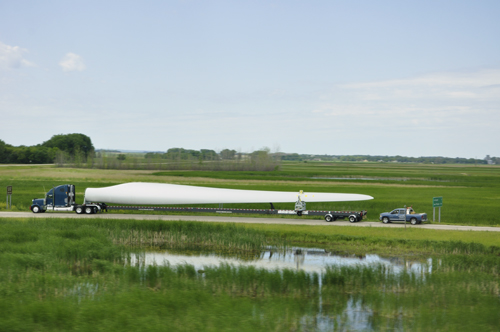 a windmill turbo blade on a semi