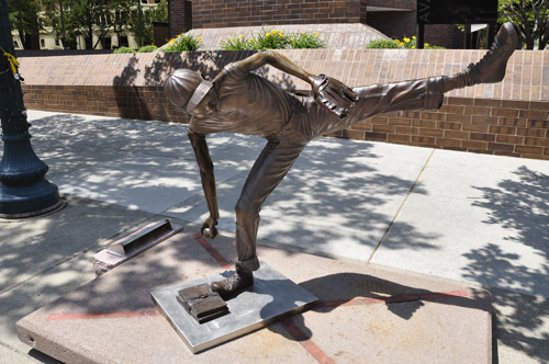 boy playing baseball sculpture