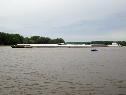 a long barge on the Mississippi River in La Crosse