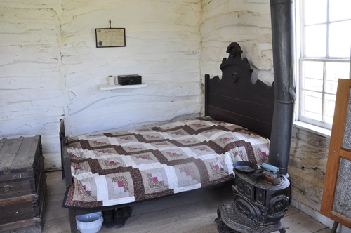 bed and stove in the cabin