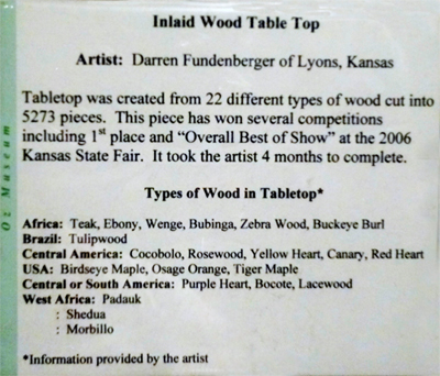 sign about the An inlaid wood table top 