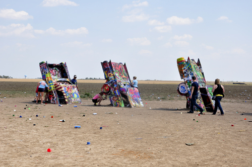 three painted cadillacs