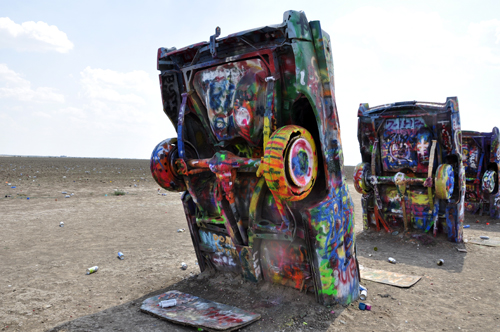 several Cadillacs at Cadillac Ranch in Texas