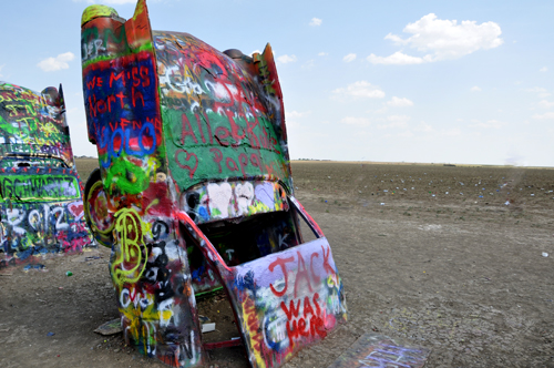 brightly painted Cadillacs