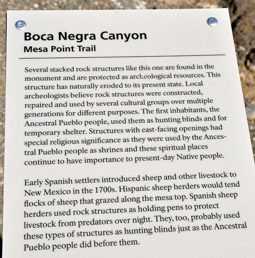 sign about rock structure at the top of the cliff