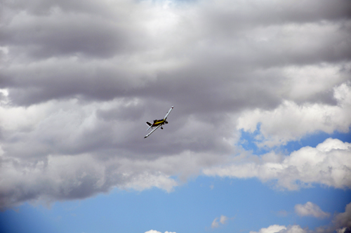 a crop plane circling the roadway