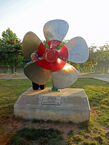 Lee Duquette by a gian towboat propeller in Clarksville, Tennessee