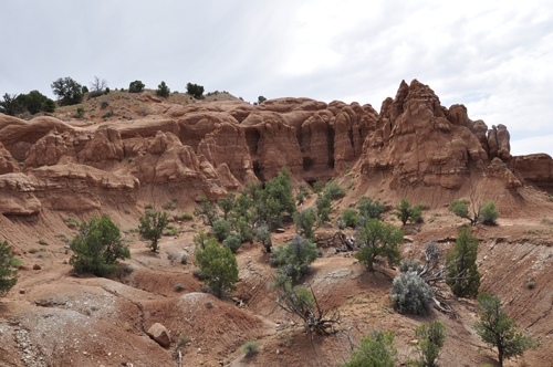 Shakespeare Arch peeks out of a hoodoo-laden sandstone formation in Kodachrome Basin