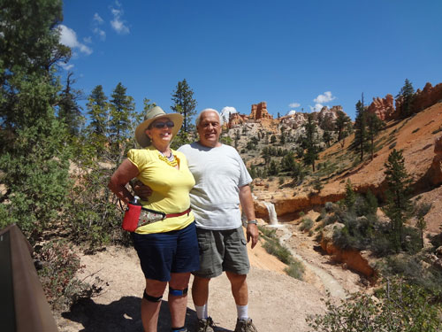 the two RV Gypsies are enjoying the view of the small waterfall.the two RV Gypsies are enjoying the view of the small waterfall.