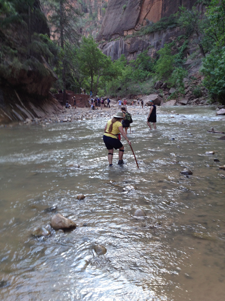 Karen Duquette walking in the Virgin River at Zion National Park