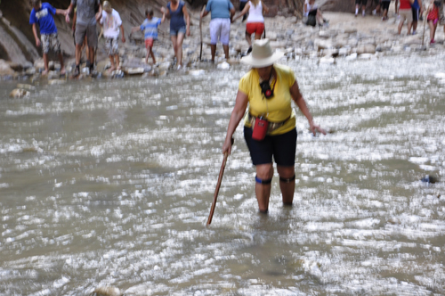 Karen Duquette walking in the Virgin River at Zion National Park