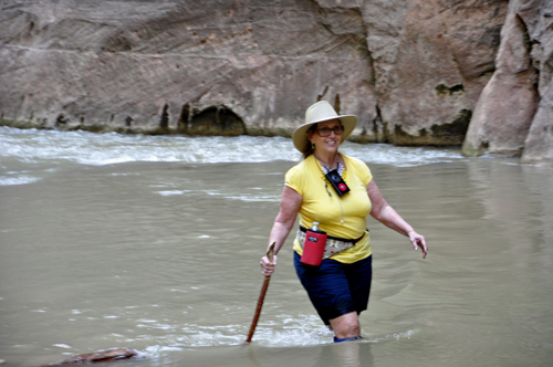 Karen Duquette walking in the Virgin River at Zion National Park