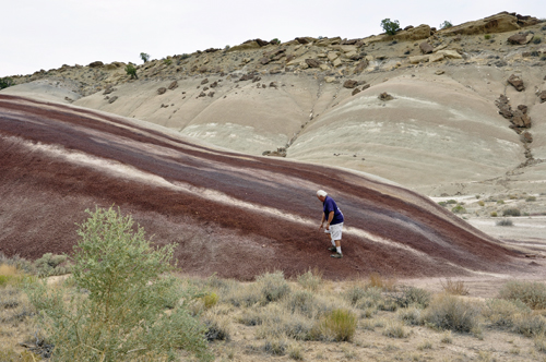 Lee Duquette checks the hill to see if it is sand or rock